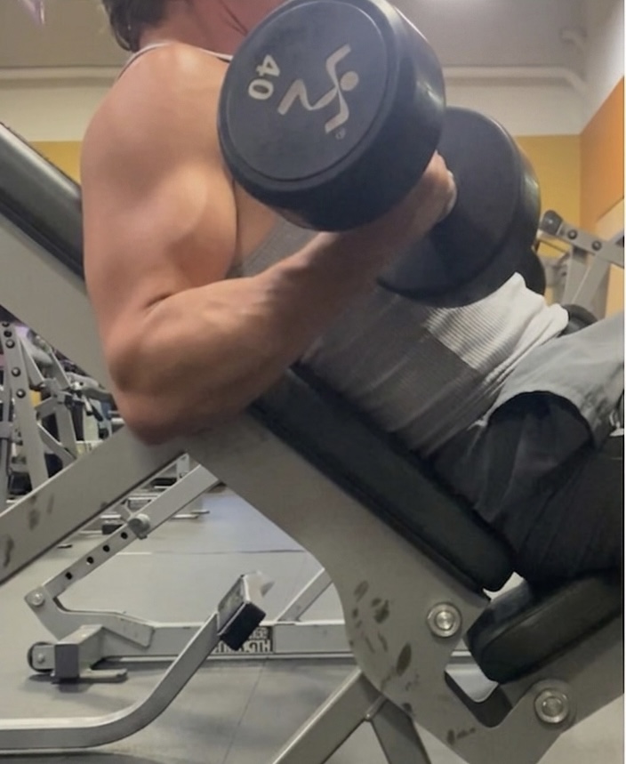 Heavy dumbbell curl on incline bench